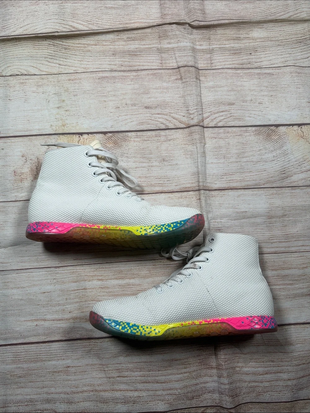 NOBULL‎ white high-top trainers featuring a vibrant multi-color glitch sole